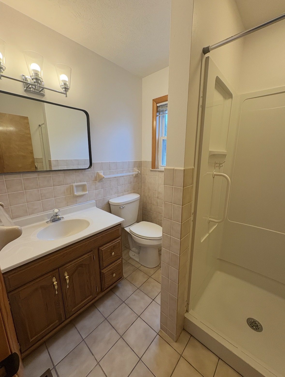Bright, spotless bathroom with gleaming tile and chrome fixtures after a deep cleaning