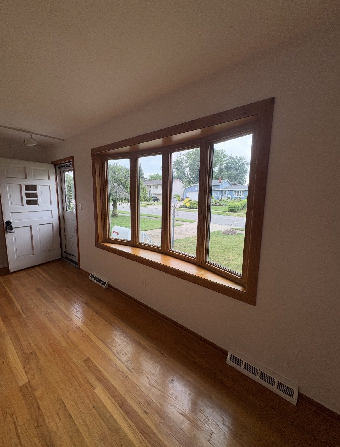 Freshly cleaned bedroom with spotless hardwood floors in an Akron area home