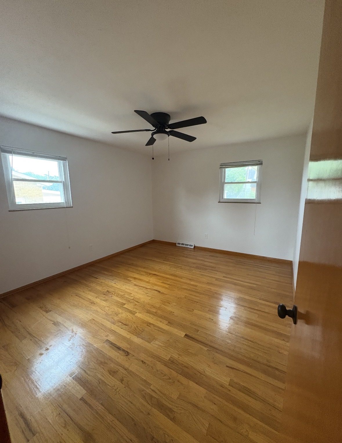 Short-term rental bedroom with crisp white linens, ready for the next guest